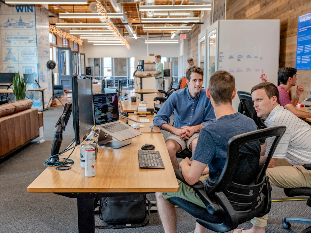 Small business colleagues planning their work together at a table